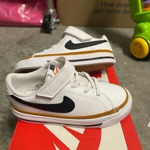 Nike Kids White Sneakers with Black and Gold Accents